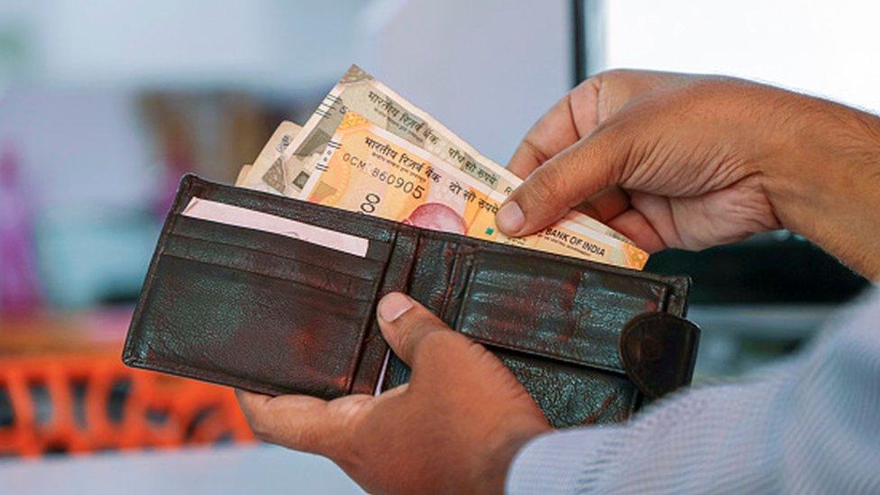 A wallet with Indian rupee