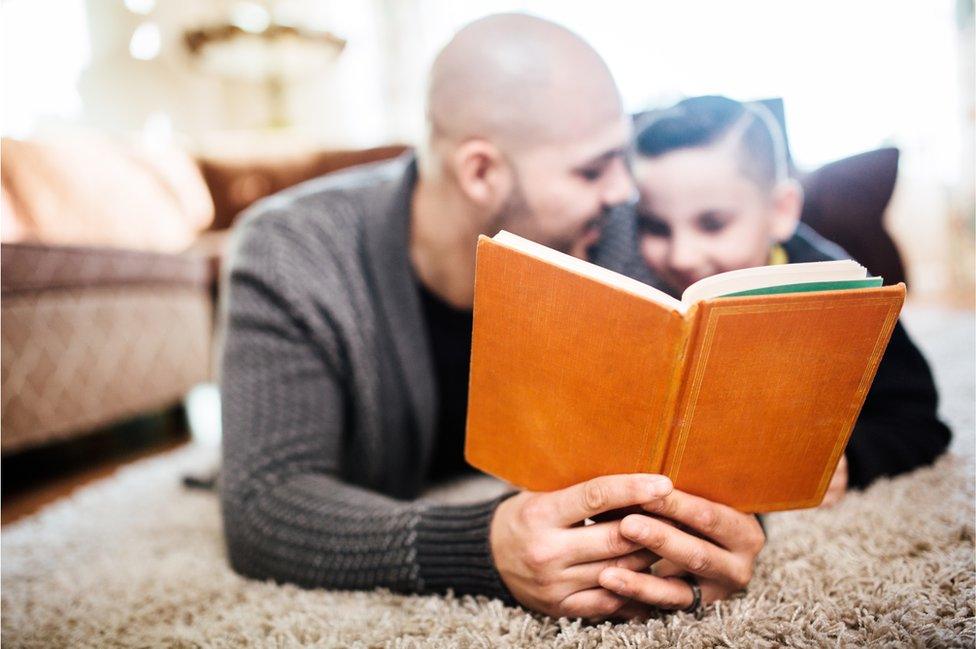 Father and son reading