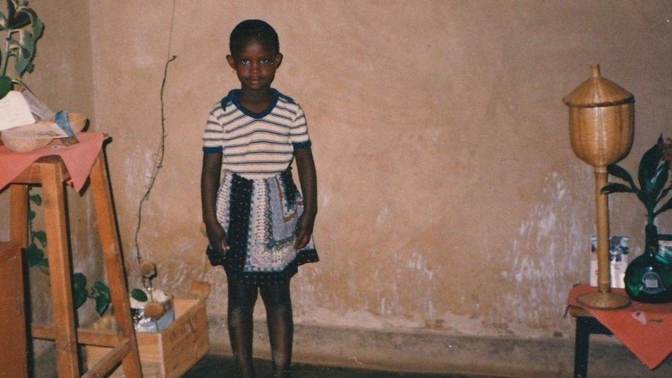 A young girl in her house