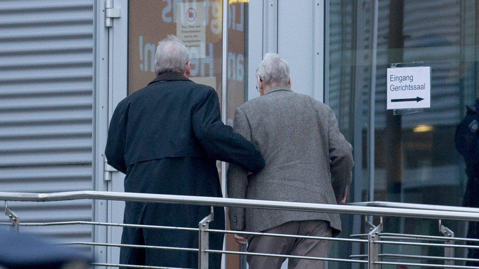 Defendant Reinhold H. (R) is brought to the Chamber of Industry and Commerce (IHK) building in Detmold, Germany (11 February 2016)