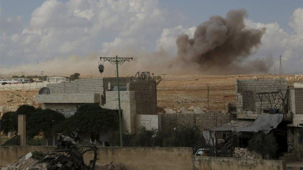 Smoke rising at Maasran, southern Idlib province, 7 October.