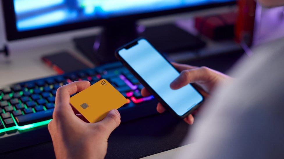 Man on phone gambling with card