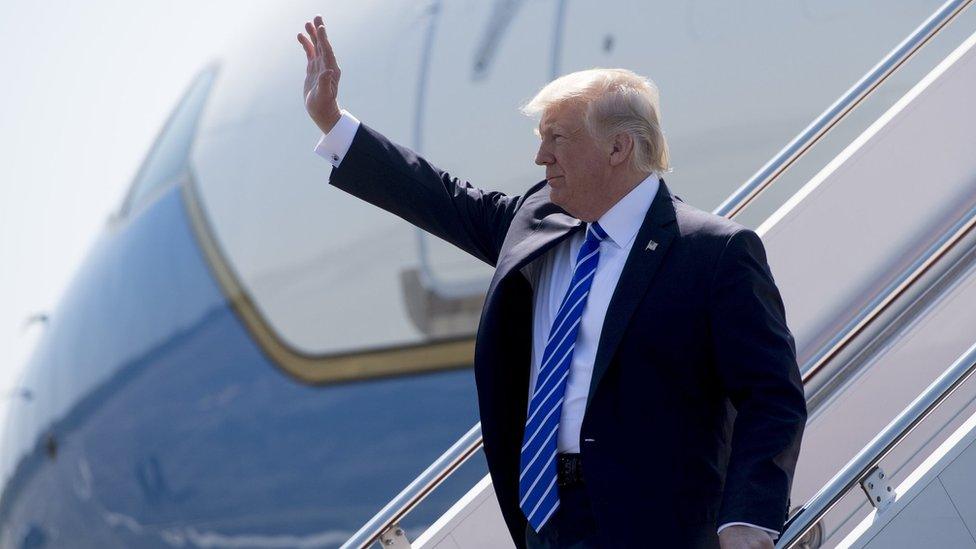 Donald Trump waves from Air Force One upon arrival at Groton-New London Airport in Groton, Connecticut (17 May 2017)