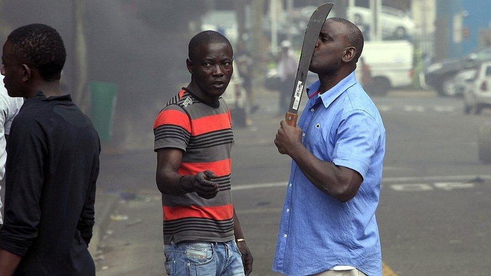 An armed man in South Africa during anti-foreigner violence