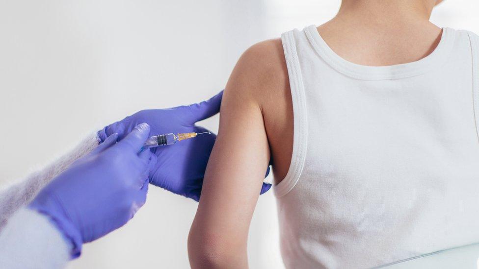 Young boy being vaccinated