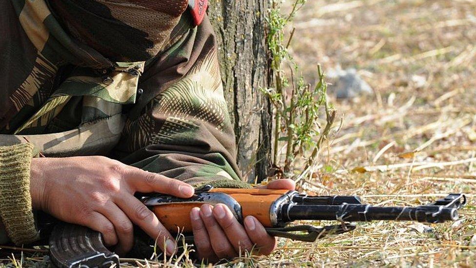 A soldier with a gun in Kashmir