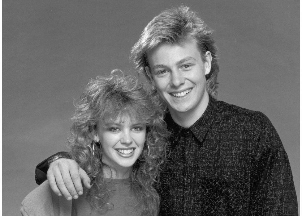 Black and white image of Kylie Minogue, with her Neighbours co-star Jason Donovan, circa 1987