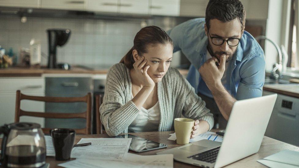 Couple looking at laptop