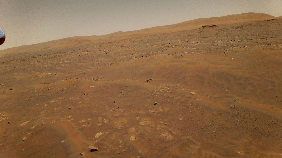 This image of Mars was taken from the height of 33 feet (10 meters) by NASA's Ingenuity Mars helicopter during its sixth flight on May 22, 2021