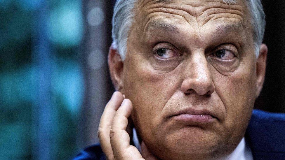 Hungary's Prime Minister Viktor Orban gestures as he addresses a press conference alongside Italy's Interior Minister Matteo Salvini following a meeting in Milan on August 28, 2018.