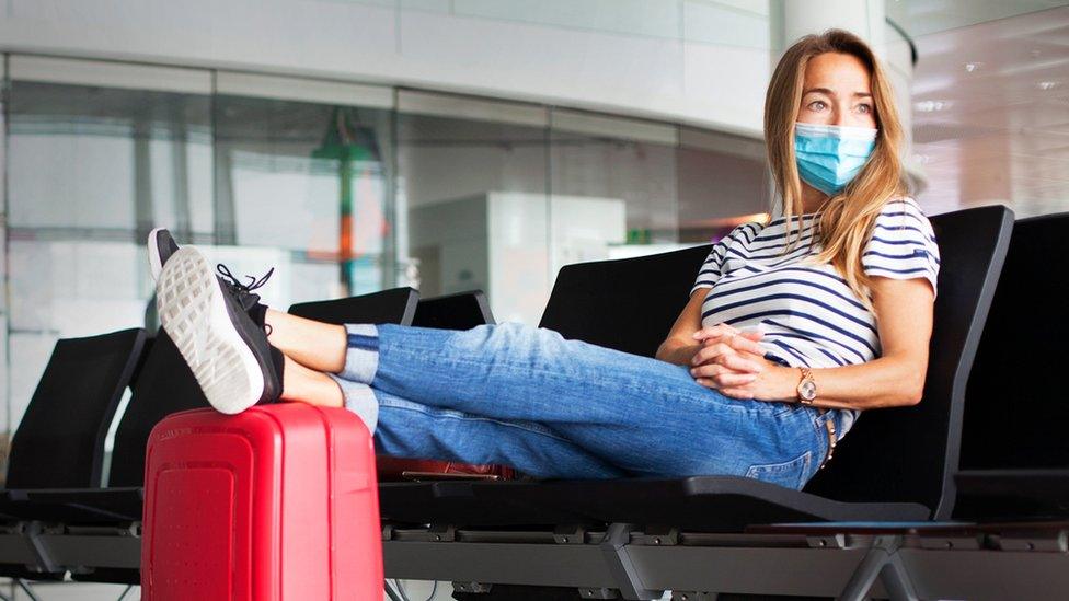 Woman wearing a mask at an airport