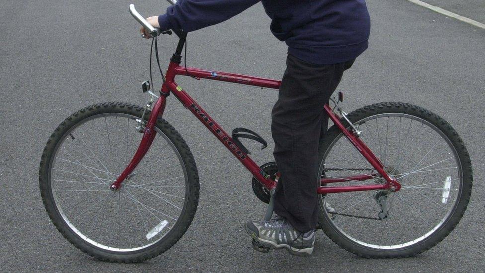 Boy on bicycle