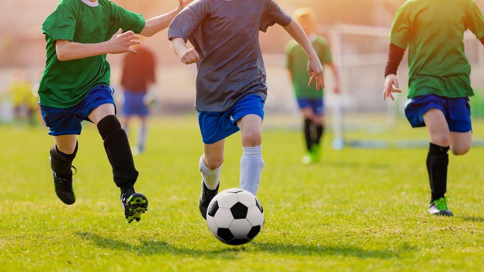 Kids playing football