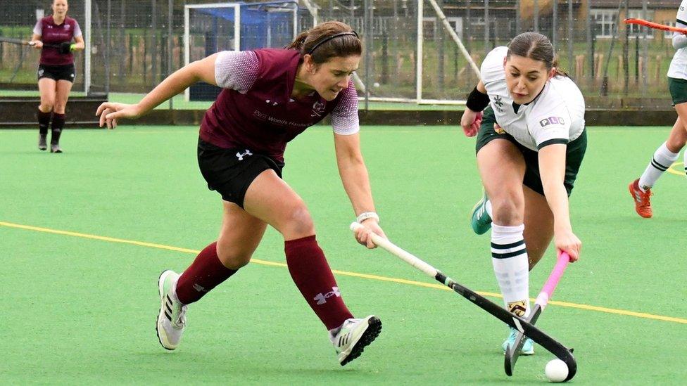 Kate Costin playing hockey