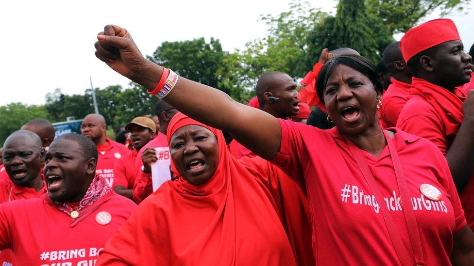 Members of Bring Back Our Girls group with fists up during a march