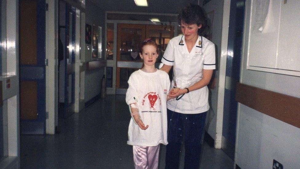 Michelle learning to walk again with nurse.