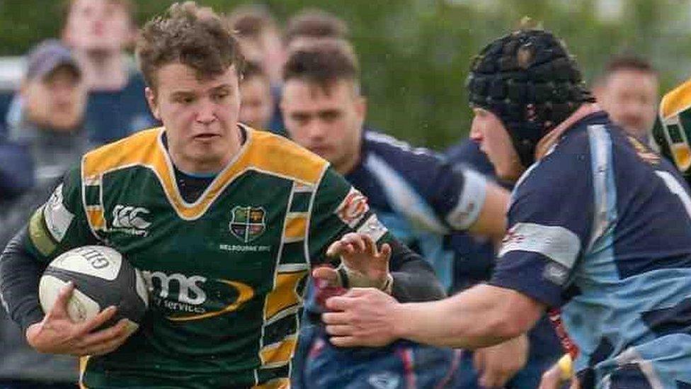 James Benstead playing rugby