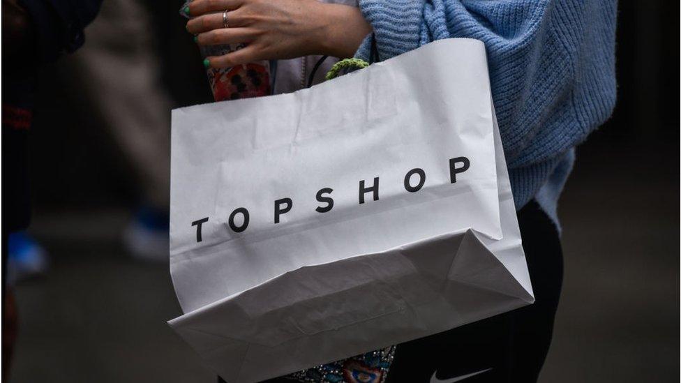 A Topshop shopping bag