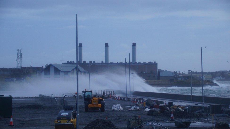 Waves crashing against