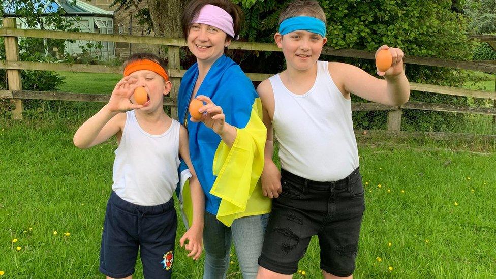 Igor, 7, Tykhon, 12, and mum Victoriia