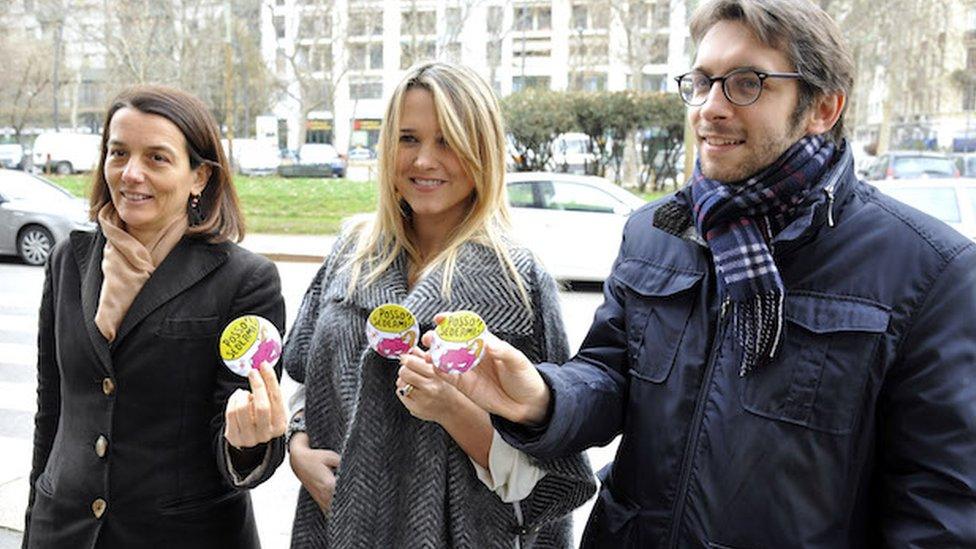 Francesca Barra (centre) holds one of the new badges