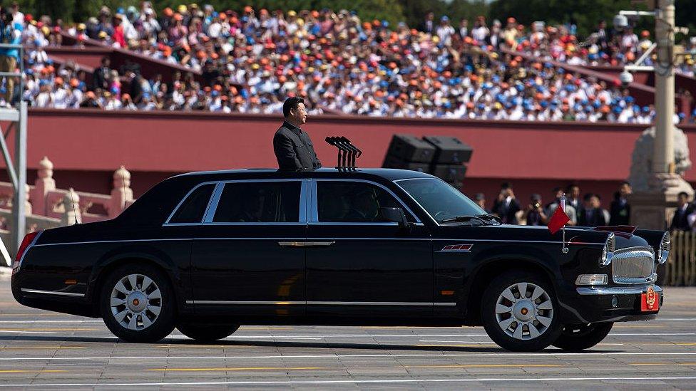 Xi Jinping in a FAW Hongqi at a military parade.