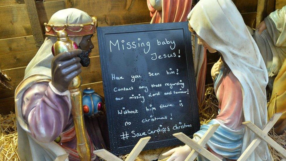 Nativity with a sign advertising missing Jesus at Cardiff Christmas Markets