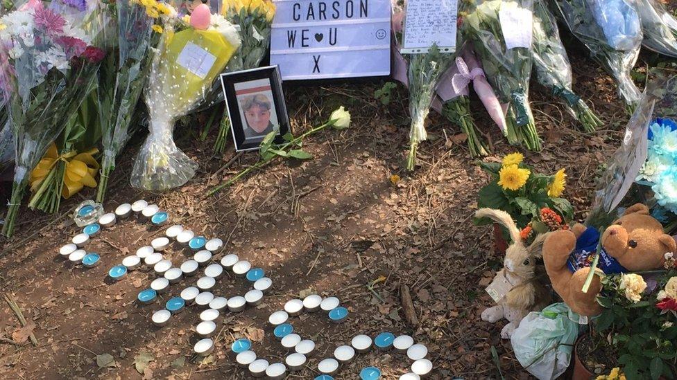 Candles and flowers at the scene