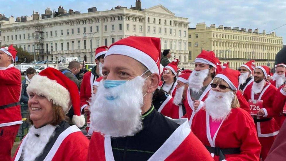 A Santa with a mask on