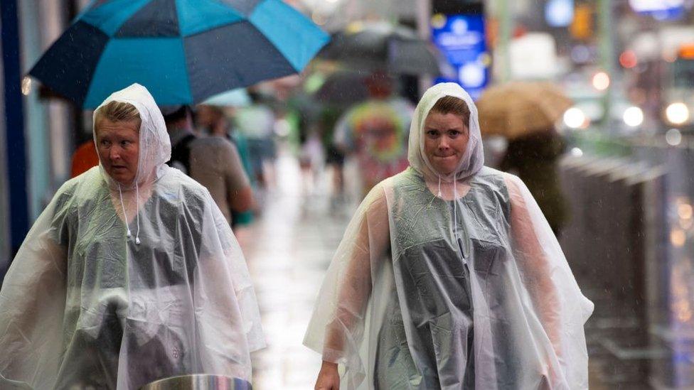 women-walking-in-rain.