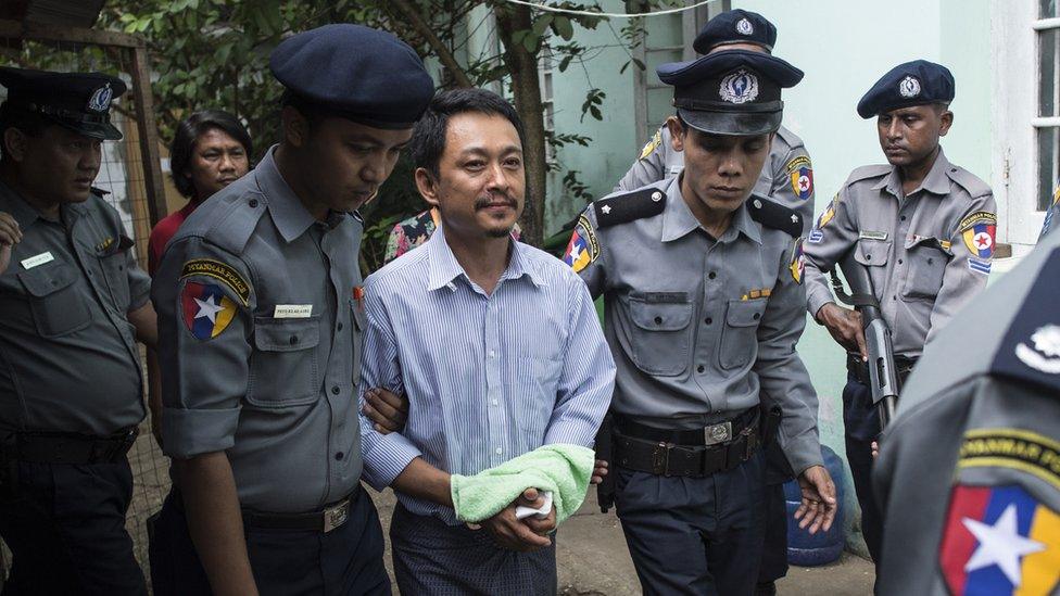 Kyaw Min Swe (C), editor-in-chief of The Voice Daily newspaper, arrives to hear the Bahan township court for the third trial in Yangon on June 16, 2017