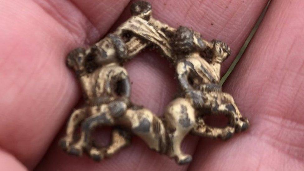 The brooch shortly after it was found