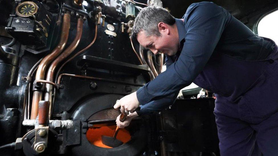 Volunteer train crew member Ian, aboard The Flying Scotsman on Platform 8 at King's Cross Station in London