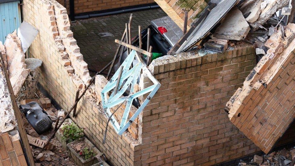 A car underneath the rubble