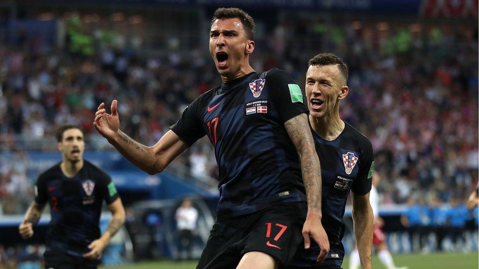 Mario Mandžukić celebrating scoring a goal.