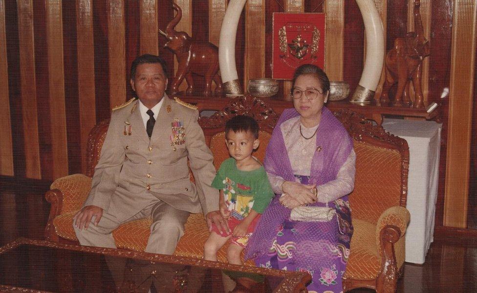 Nay Shwe Thway Aung as a child, with grandfather Than Shwe and his wife