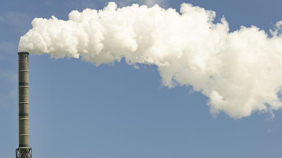 Smoke coming out of an industrial chimney