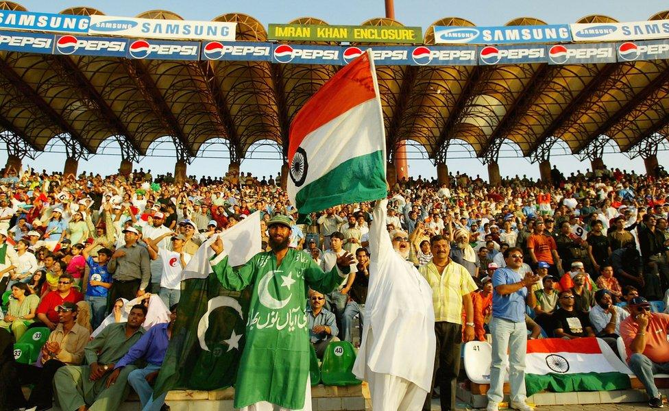 Pakistan and India supporters watch the match in the stands during the fifth Pakistan v India one-day international match played at the Gadaffi Stadium on March 24, 2004 in Lahore, Pakistan.