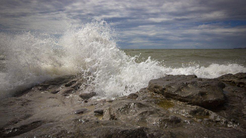 Waves crash on rocks at Ogmore-by-Sea, Vale of Glamorgan, captured by Mark Tugwell