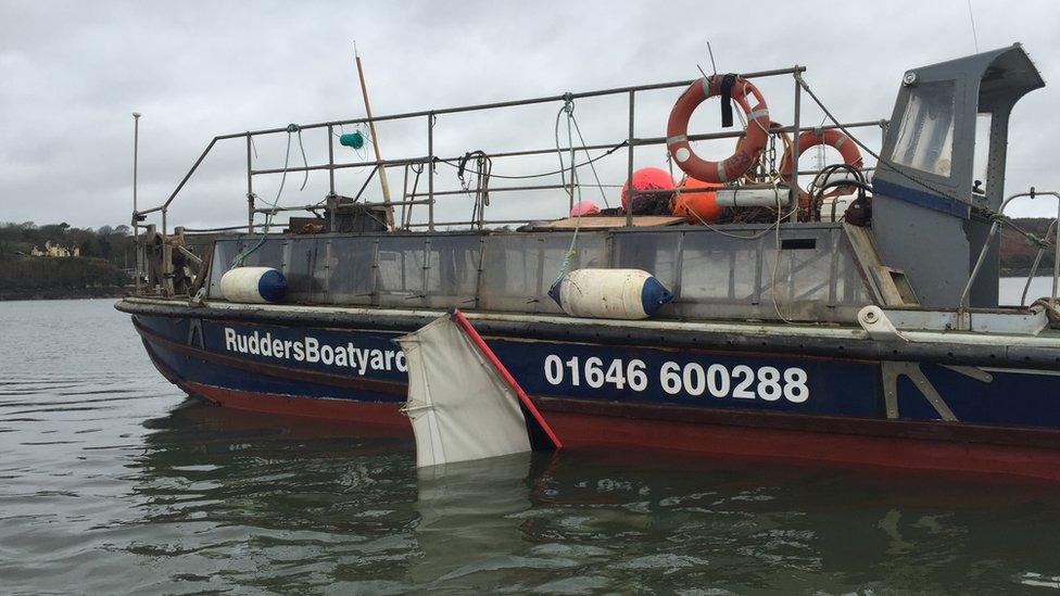 The aircraft being recovered from the river