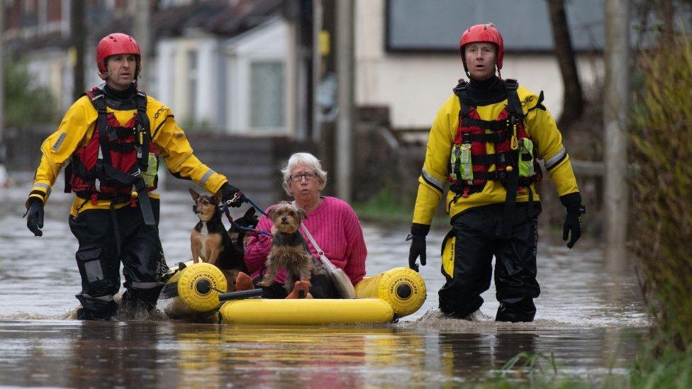 A woman is rescued with her dogs in Nantgarw