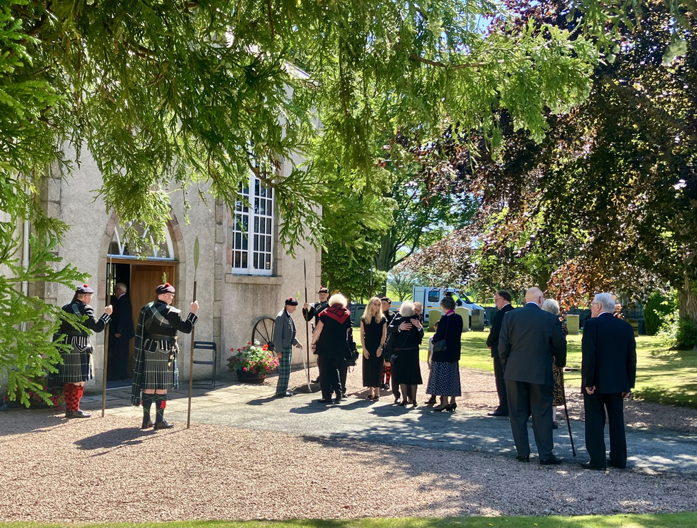 mourners at funeral of robbie shepherd