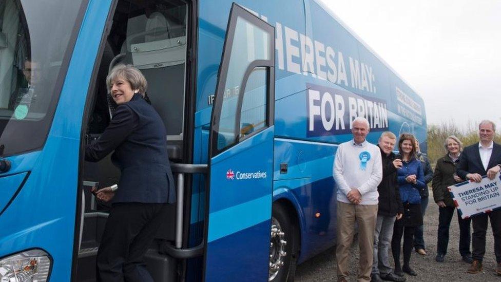 Theresa May boards her battle bus