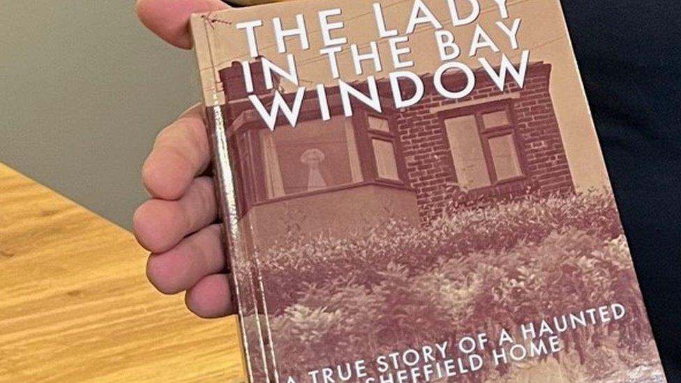 The lady in the bay window (close-up)