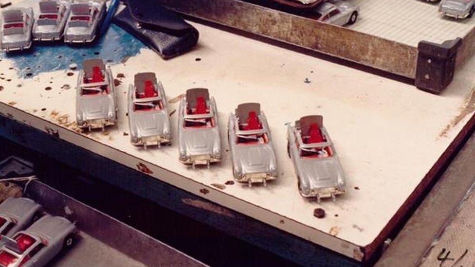 Five Aston Martin DB5's on the workbench