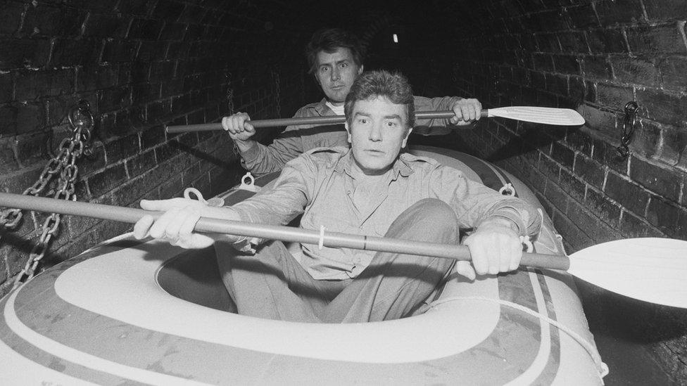 Finney and Martin Sheen filming on a boat