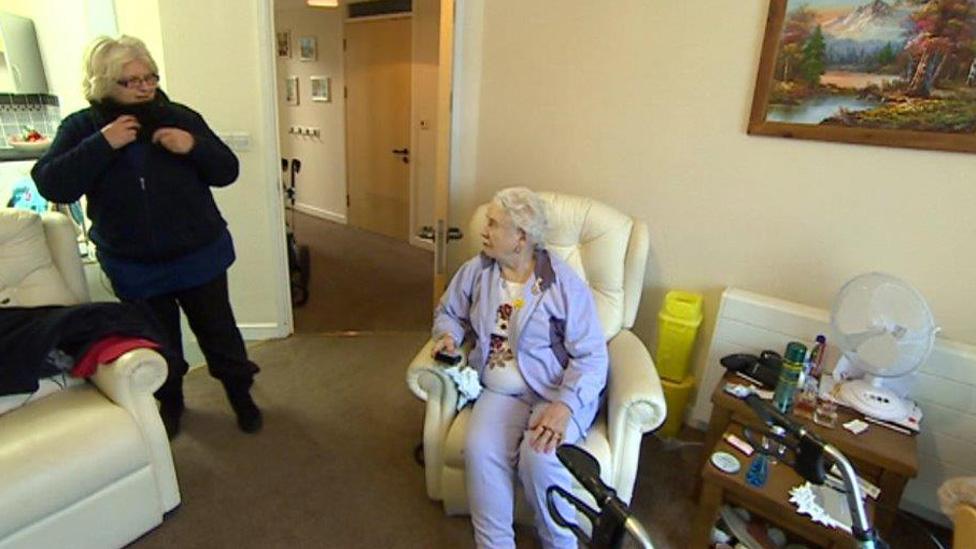 Jane Jordan, nursing sister, arrives to see Margaret Tolley, 81