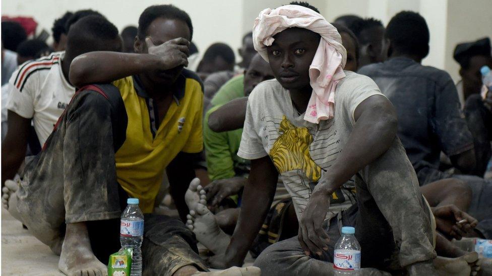 Survivors from a boat that capsized, off Egypt's north coast, sit in a police station in Rashid in northern Egypt, on September 21, 2016