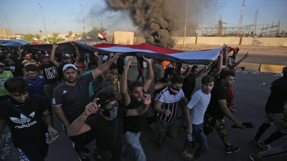 Iraqi protesters take part in a demonstration against state corruption, failing public services, and unemployment, in the Iraqi capital Baghdad's central Khellani Square on October 4, 2019.