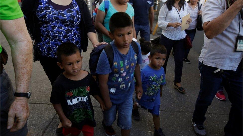 Children walking to the US border